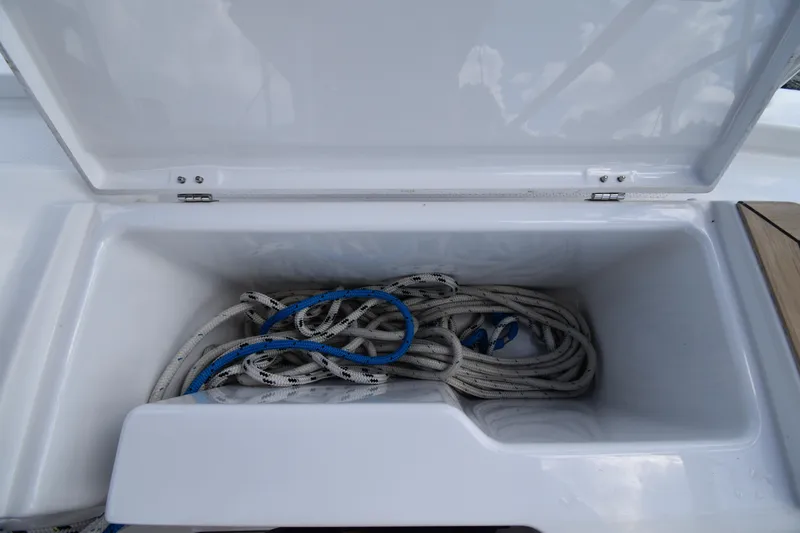 Maelynn Rose Yacht Photos Pics Open storage compartment on 2019 Hanse 458 yacht with coiled ropes inside.