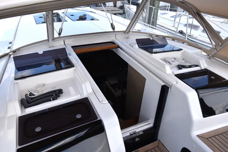 Maelynn Rose Yacht Photos Pics 2019 Hanse 458 yacht cockpit with open hatch and sleek design.