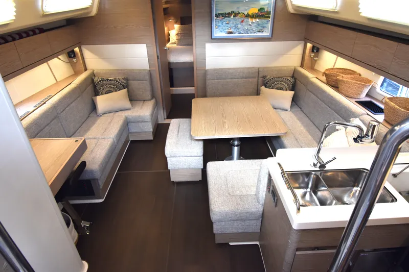 Maelynn Rose Yacht Photos Pics Interior of 2019 Hanse 458 yacht with modern seating and kitchen area.