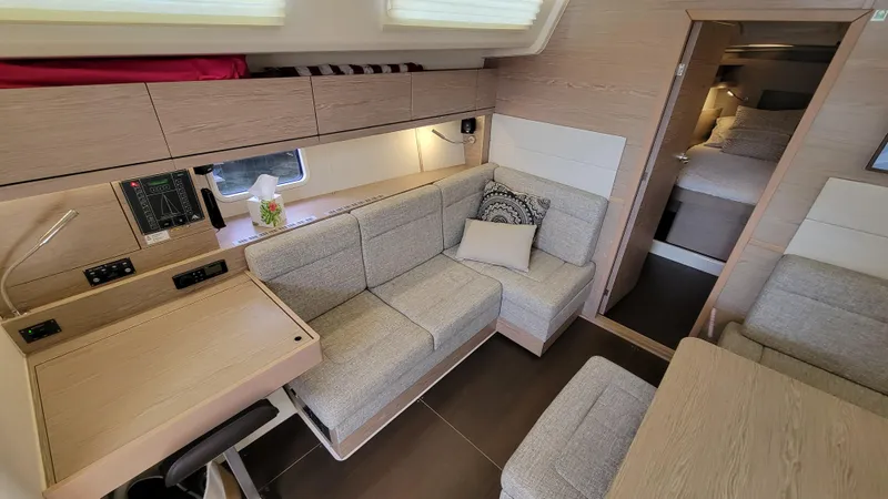 Maelynn Rose Yacht Photos Pics 2019 Hanse 458 yacht interior with modern seating and cozy cabin.