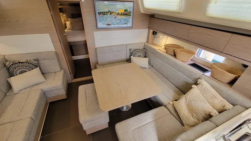 Maelynn Rose Yacht Photos Pics Luxurious 2019 Hanse 458 yacht interior with cozy seating and elegant decor.
