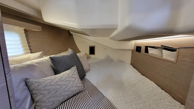 Maelynn Rose Yacht Photos Pics Cozy interior cabin of 2019 Hanse 458 yacht with plush bedding and modern design.