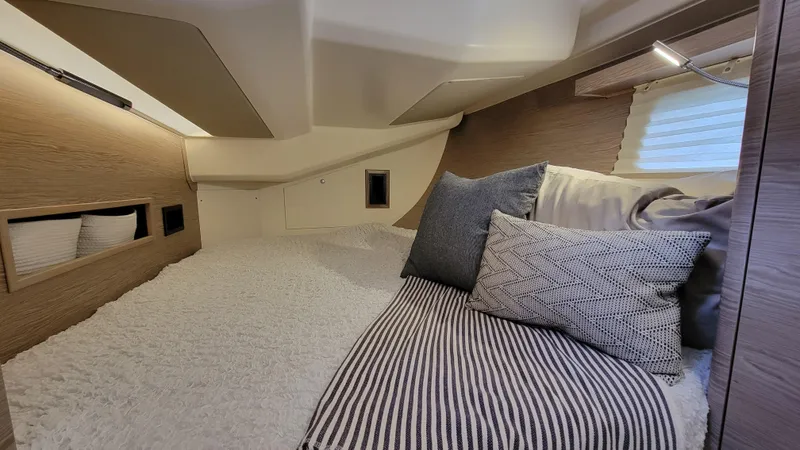 Maelynn Rose Yacht Photos Pics Luxurious interior cabin of 2019 Hanse 458 yacht with cozy bedding and modern design.