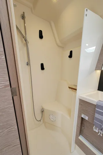 Maelynn Rose Yacht Photos Pics Modern shower area in 2019 Hanse 458 yacht, featuring sleek design and fixtures.