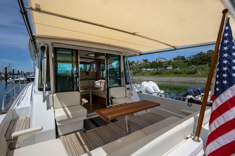 Luca Yacht Photos Pics 2023 Sabre 43 Salon Express yacht with shaded outdoor seating area.