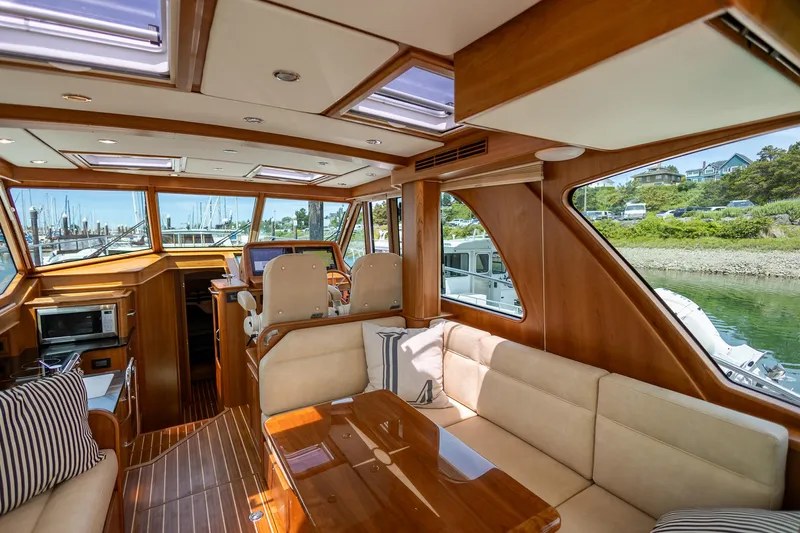 Luca Yacht Photos Pics Interior of 2023 Sabre 43 Salon Express yacht with luxurious seating and wooden finishes.