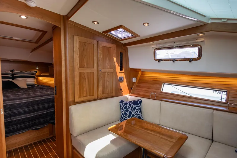 Luca Yacht Photos Pics Interior of 2023 Sabre 43 Salon Express yacht with cozy seating and wooden finishes.