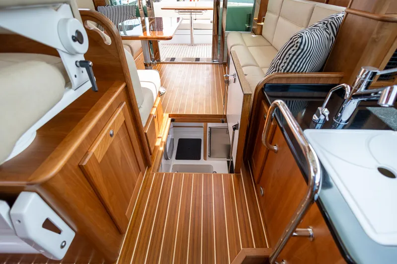 Luca Yacht Photos Pics Interior of 2023 Sabre 43 Salon Express yacht with wooden flooring and modern amenities.