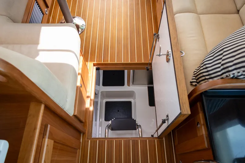 Luca Yacht Photos Pics 2023 Sabre 43 Salon Express interior with open hatch and wooden flooring.