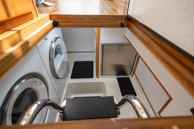 Luca Yacht Photos Pics Laundry area in 2023 Sabre 43 Salon Express yacht with washer and dryer.