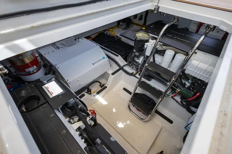 Luca Yacht Photos Pics Engine room of 2023 Sabre 43 Salon Express yacht with equipment and ladder.