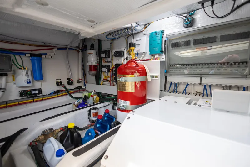 Luca Yacht Photos Pics Engine room of 2023 Sabre 43 Salon Express yacht with fire extinguisher and maintenance supplies.