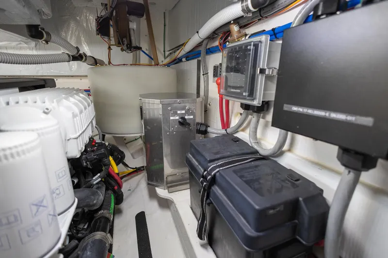 Luca Yacht Photos Pics Engine room of a 2023 Sabre 43 Salon Express yacht with various mechanical components.