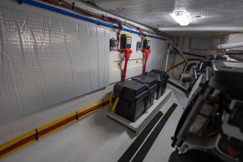 Luca Yacht Photos Pics Engine room of 2023 Sabre 43 Salon Express yacht with battery boxes and wiring.