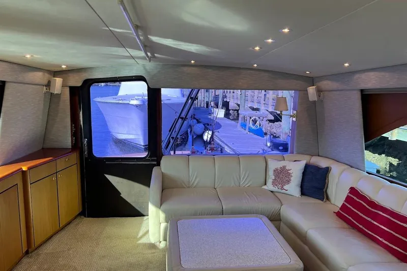 Reel Interest Yacht Photos Pics Luxurious interior of 2002 Ocean Yachts 56 Super Sport with plush seating and elegant decor.