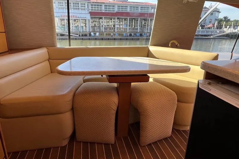 Reel Interest Yacht Photos Pics Luxurious interior of 2002 Ocean Yachts 56 Super Sport with elegant dining area.