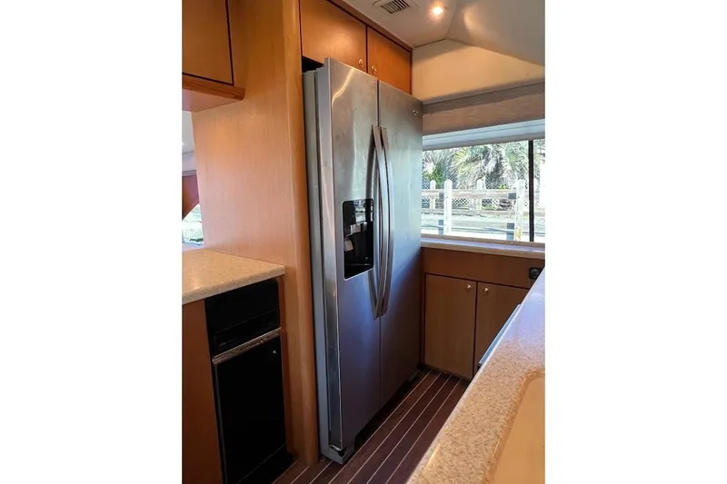 Reel Interest Yacht Photos Pics Interior of 2002 Ocean Yachts 56 Super Sport with modern kitchen appliances.