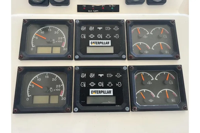 Reel Interest Yacht Photos Pics Instrument panel of a 2002 Ocean Yachts 56 Super Sport with Caterpillar gauges.