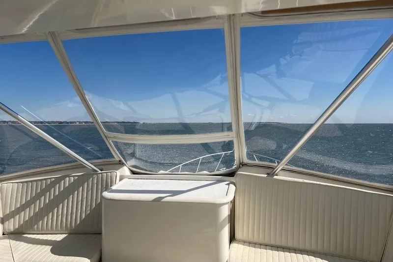 Reel Interest Yacht Photos Pics 2002 Ocean Yachts 56 Super Sport interior with ocean view through windows.