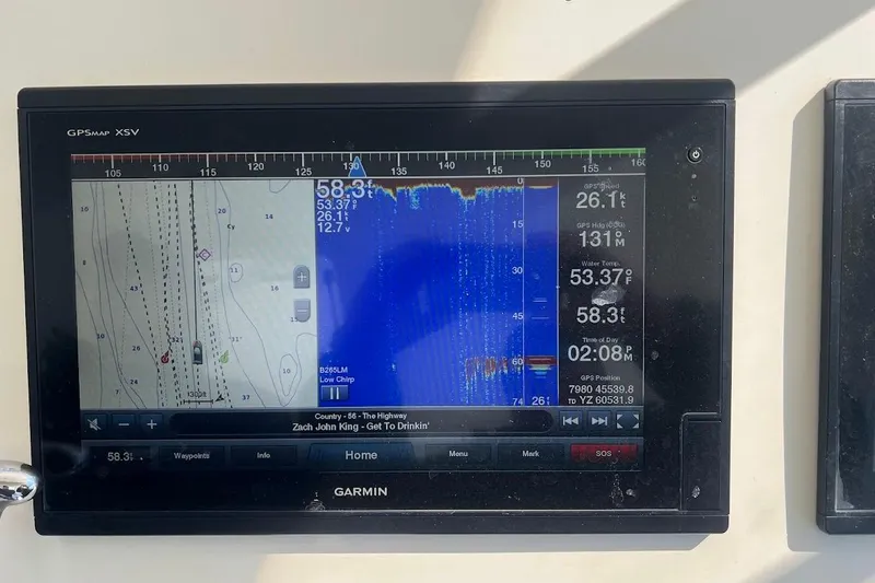 Reel Interest Yacht Photos Pics Garmin GPS display on 2002 Ocean Yachts 56 Super Sport, showing navigation and sonar data.