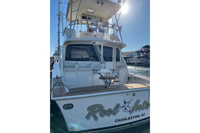 Reel Interest Yacht Photos Pics 2002 Ocean Yachts 56 Super Sport docked in Charleston, SC, rear view.