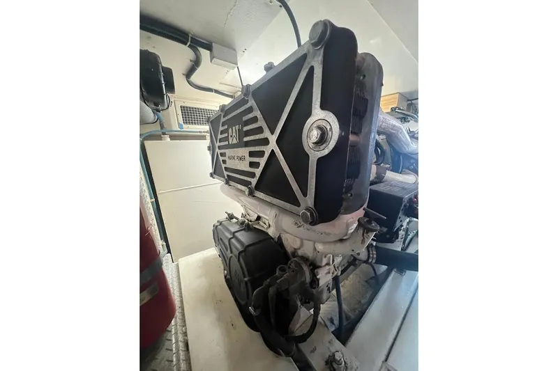 Reel Interest Yacht Photos Pics Engine room of 2002 Ocean Yachts 56 Super Sport, featuring CAT marine power engine.