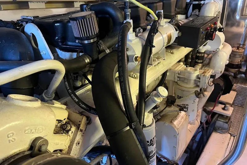 Reel Interest Yacht Photos Pics Engine compartment of a 2002 Ocean Yachts 56 Super Sport, showcasing detailed components.