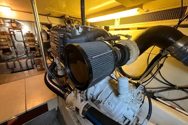 Reel Interest Yacht Photos Pics Engine room of 2002 Ocean Yachts 56 Super Sport, showcasing mechanical components.