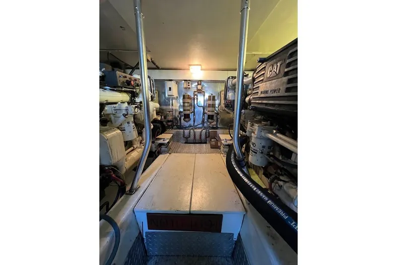 Reel Interest Yacht Photos Pics Engine room of 2002 Ocean Yachts 56 Super Sport, featuring CAT marine power systems.