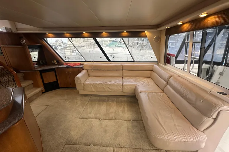 Stacey Lee Yacht Photos Pics Luxurious interior of 1999 Bayliner 4788 Pilot House Motoryacht with beige leather seating.