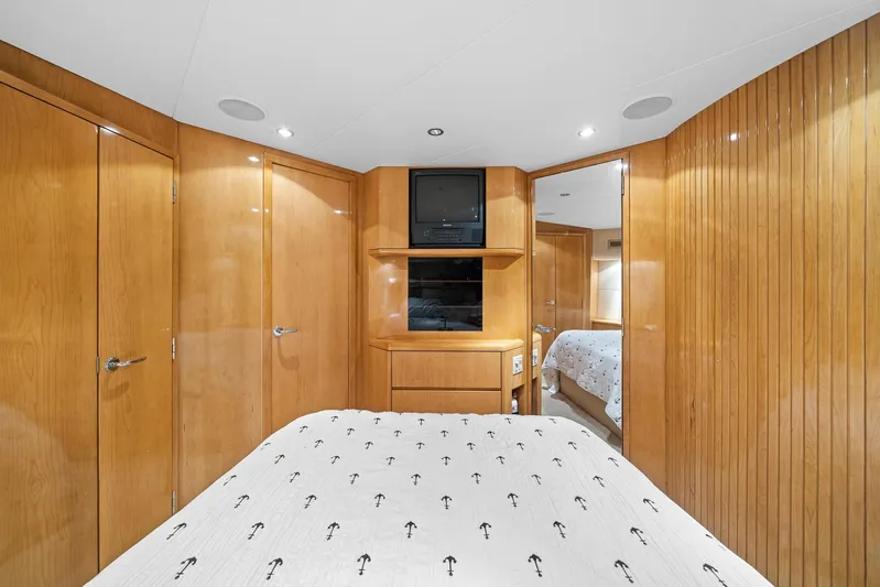 Sand Control Yacht Photos Pics Luxurious cabin interior of 2002 Hatteras 60 Convertible yacht with wood paneling.