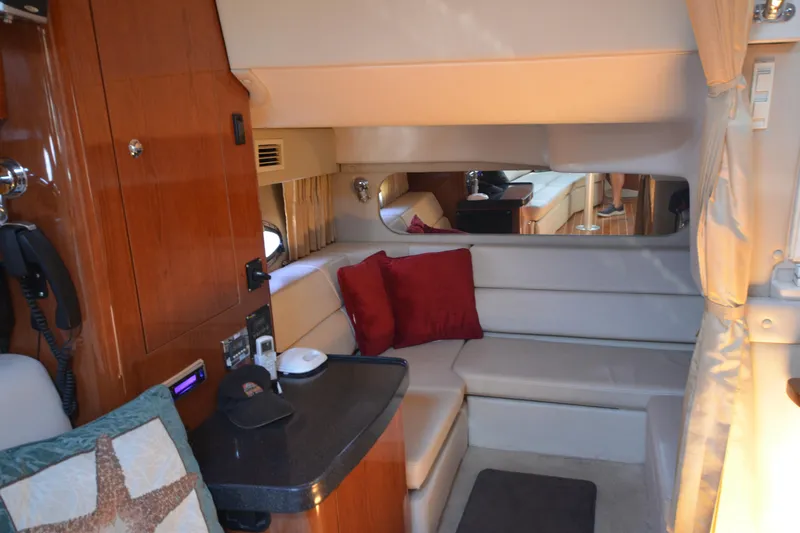  Yacht Photos Pics Interior of 2006 Regal Commodore 3560 yacht with cozy seating and elegant wood finishes.