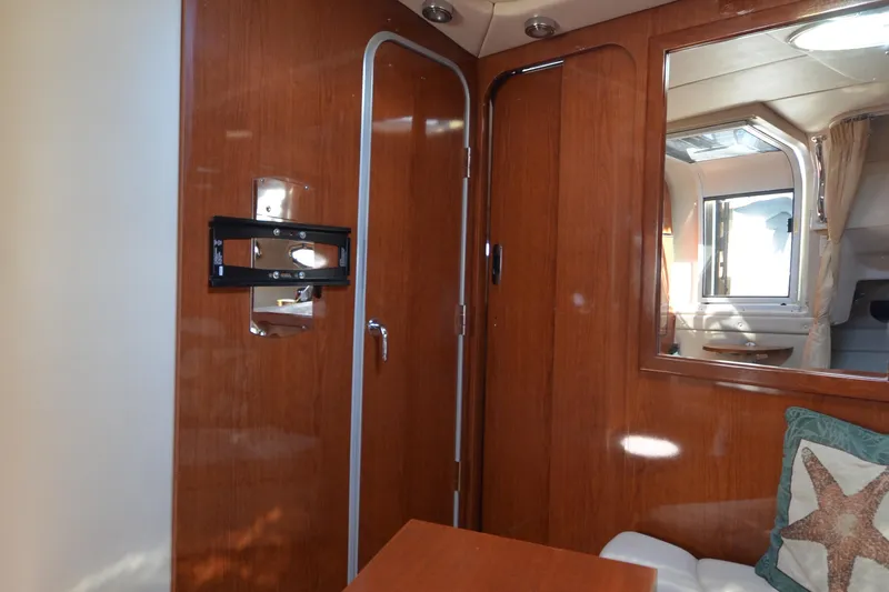  Yacht Photos Pics Interior of 2006 Regal Commodore 3560 yacht with wood paneling and window view.