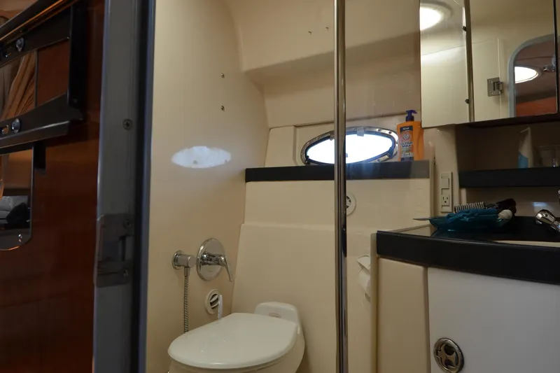  Yacht Photos Pics Bathroom interior of 2006 Regal Commodore 3560 yacht, featuring toilet and sink.