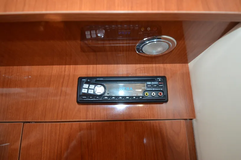  Yacht Photos Pics Audio system in 2006 Regal Commodore 3560 boat, featuring a NESA DVD player.