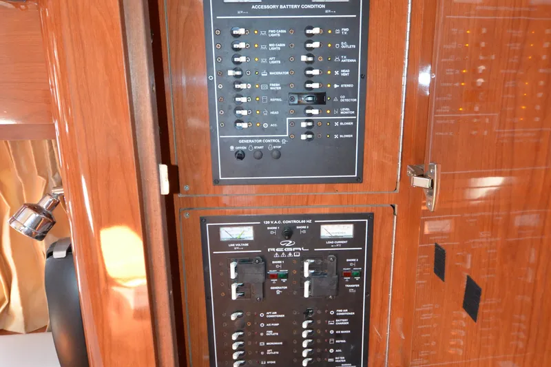  Yacht Photos Pics Control panel of a 2006 Regal Commodore 3560 boat, featuring various switches and indicators.