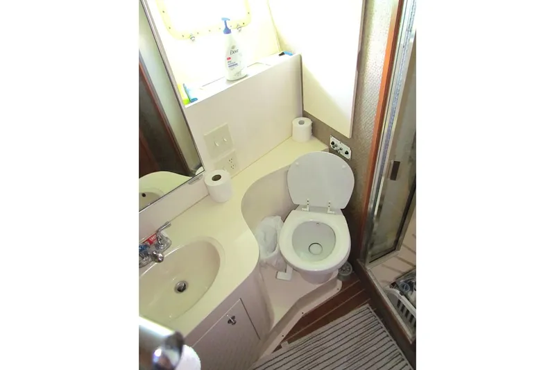  Yacht Photos Pics Bathroom of 1992 Hatteras 40 Motor Yacht with sink, toilet, and shower.