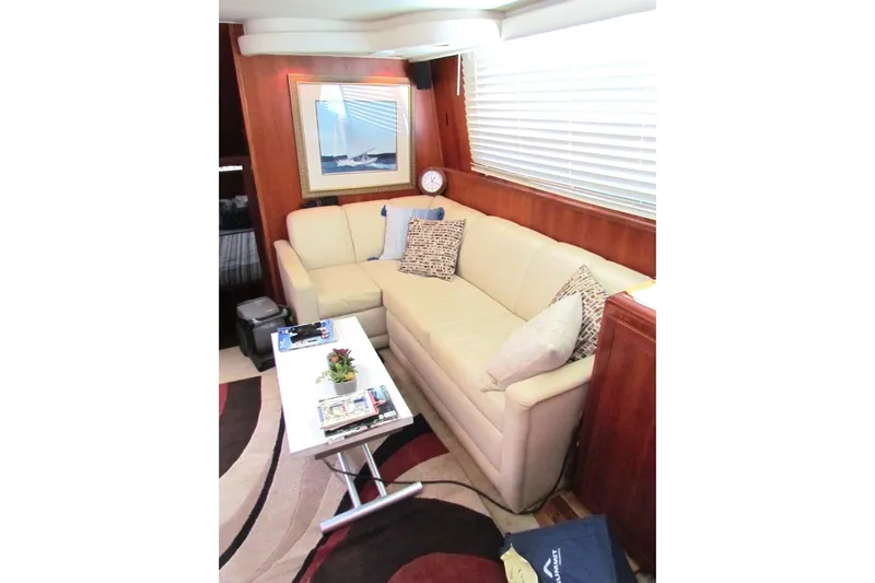  Yacht Photos Pics Interior of 1992 Hatteras 40 Motor Yacht with cozy seating and nautical decor.