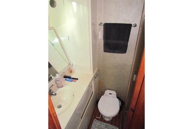  Yacht Photos Pics Bathroom interior of 1992 Hatteras 40 Motor Yacht with sink and toilet.