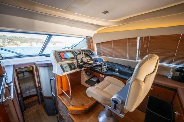  Yacht Photos Pics 2015 Sea Ray 510 Fly yacht helm with modern controls and panoramic windows.