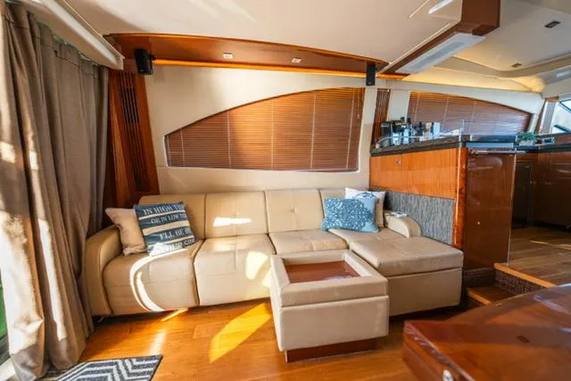  Yacht Photos Pics Luxurious interior of 2015 Sea Ray 510 Fly yacht with beige leather seating.
