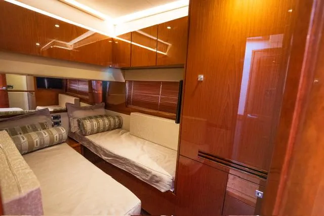  Yacht Photos Pics Interior of 2015 Sea Ray 510 Fly yacht with luxurious wood finish and comfortable seating.