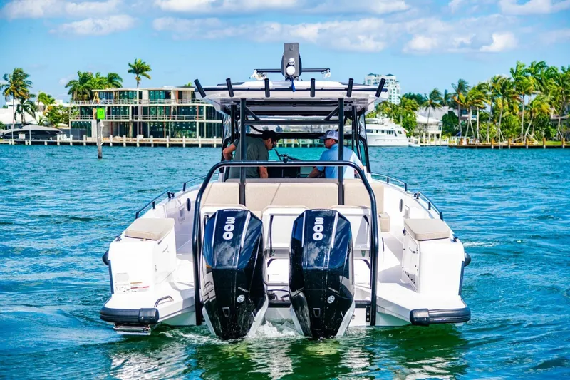 First Byte Yacht Photos Pics 2023 Axopar 37 Sun Top boat cruising on a sunny day with twin engines.