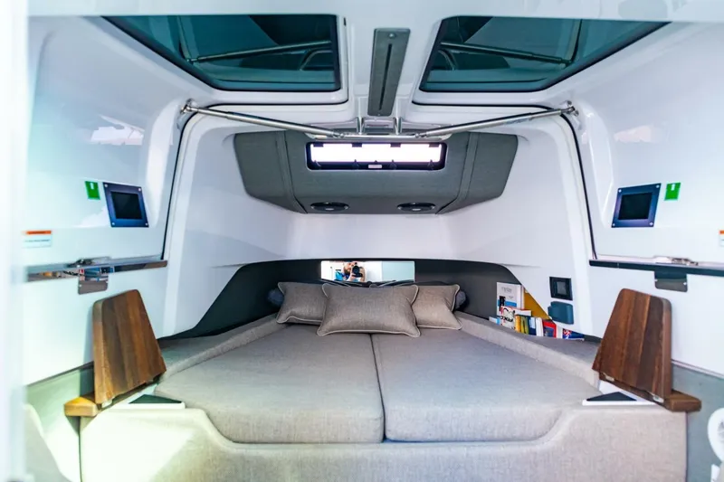 First Byte Yacht Photos Pics Interior cabin of 2023 Axopar 37 Sun Top with modern design and comfortable bedding.