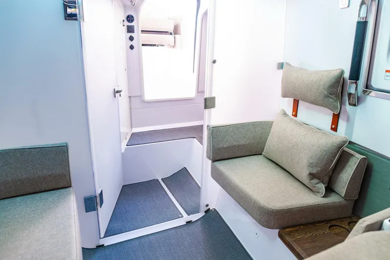 First Byte Yacht Photos Pics 2023 Axopar 37 Sun Top interior with modern seating and sleek design.