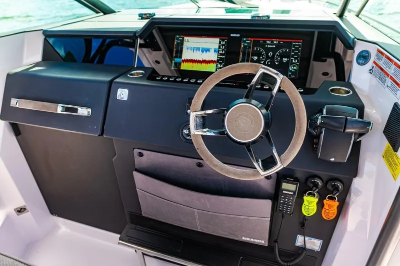 First Byte Yacht Photos Pics 2023 Axopar 37 Sun Top dashboard with modern controls and navigation displays.