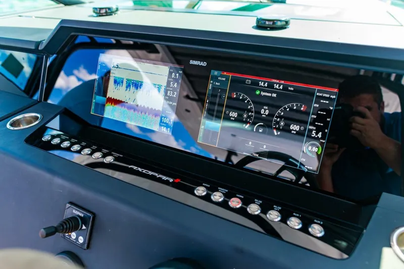 First Byte Yacht Photos Pics Dashboard of 2023 Axopar 37 Sun Top with advanced navigation displays.