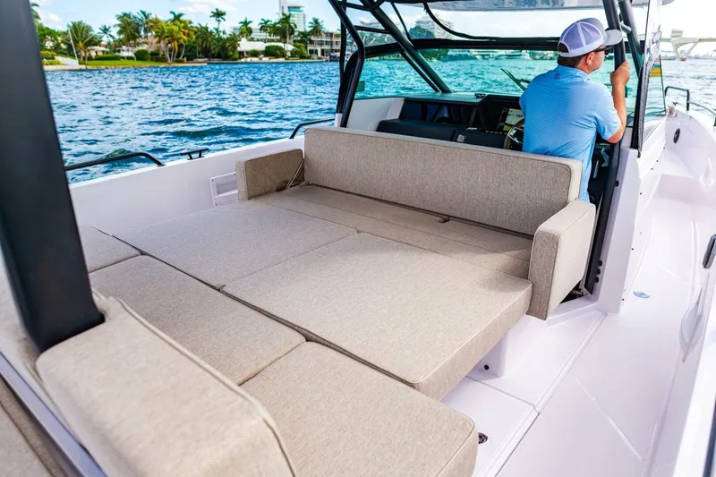 First Byte Yacht Photos Pics 2023 Axopar 37 Sun Top boat interior with spacious seating and scenic water view.