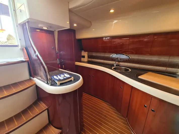 Rmvca Yacht Photos Pics Luxurious 2004 Fairline Targa 43 yacht interior with elegant wood finish and modern kitchen amenities.