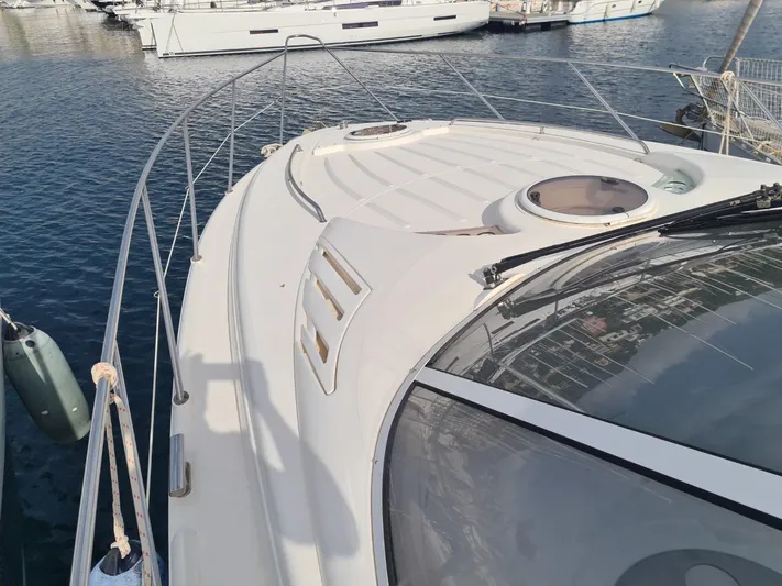 Rmvca Yacht Photos Pics 2004 Fairline Targa 43 yacht deck view in marina setting.